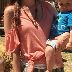 Women’s pink, cold shoulder top. Size small.